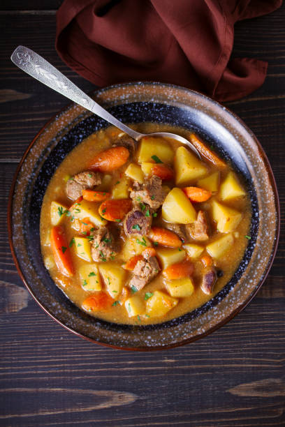 istock Homemade beef stew with vegetables in bowl on wooden table 1143207285