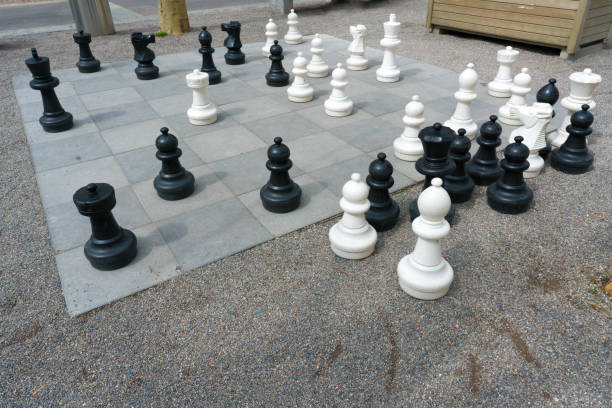 istock giant chess set and figures in a city square 1143207287