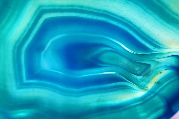 istock Agate stone macro background.blue agate stone slice .Natural stone bright blue background. Phone wallpaper 1143208039