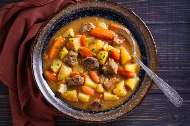 istock Homemade beef stew with vegetables in bowl on wooden table 1143208067