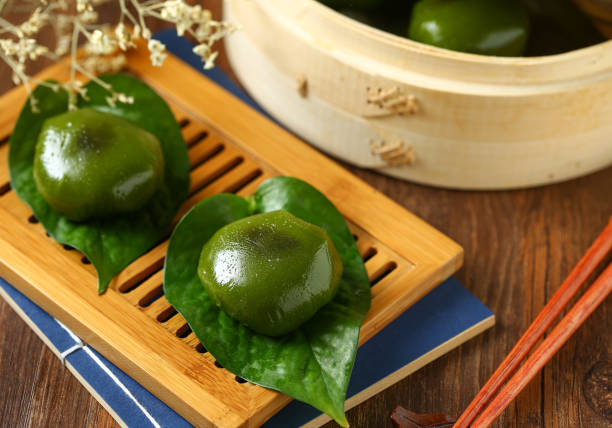 traditional Chinese qingming festival food green rice ball traditional Chinese qingming festival food green rice ball suzhou stock pictures, royalty-free photos & images