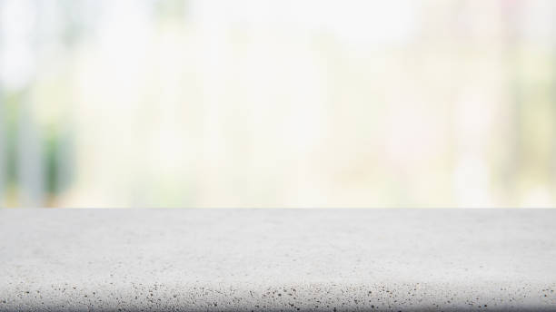 istock Empty white concrete cement table top and blurred abstract restaurant interior background - can used for display or montage your products. 1143209765