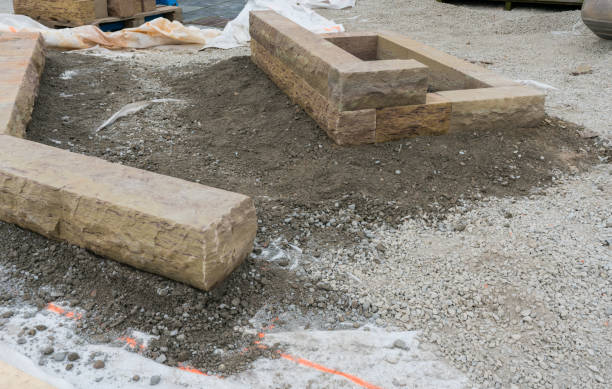 istock building a a stone wall with red granite during a landscape construction job 1143211046