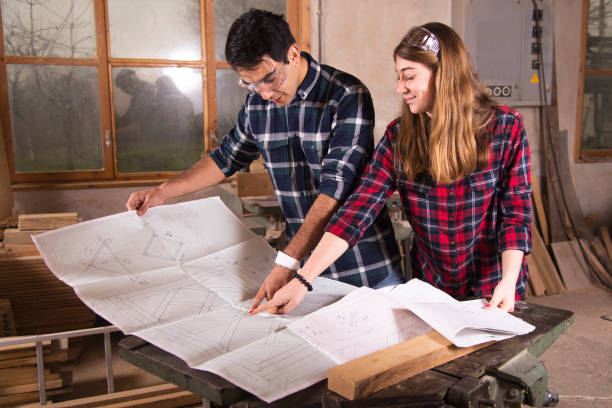 istock A family of carpenters from different ethnicities in the workshop. 1143211408