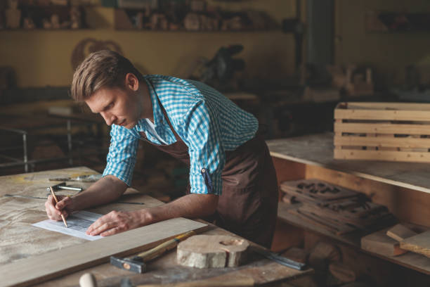 istock Young carpenter in the carpentry 1143214135