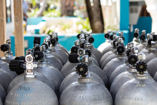 Scuba Diving tanks can be made of aluminium or steel, the material they are made of is important to the diver as their weight is inflicting the buoyancy of the diver underwater. Here are a lot of tanks stacked up for usage of shore diving of the beautiful tropical island of bonaire.