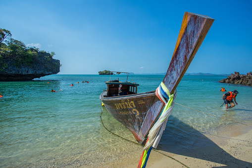 Krabi Thailand 3 Feb 2018: Longtail boat anchored at the Island prepare for tourist diving in Krabi province Thailand. Phi Phi is part of Phi Phi national park.