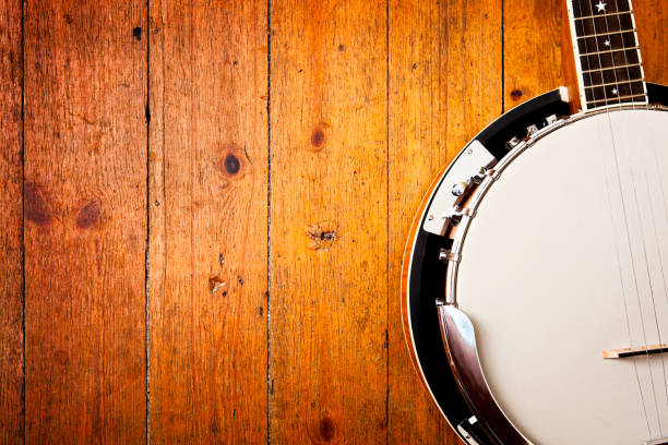 Banjo on wood background  banjo stock pictures, royalty-free photos & images