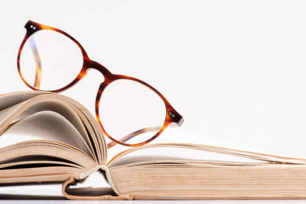 istock Book with reading eyeglasses close-up 1143228642