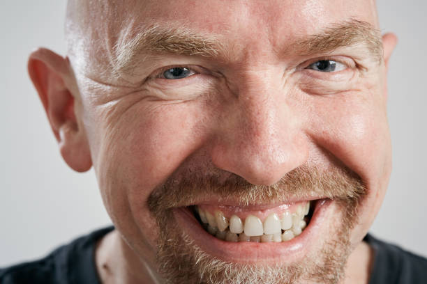 istock Happily smiling middle-aged man in cropped close-up 1143231516