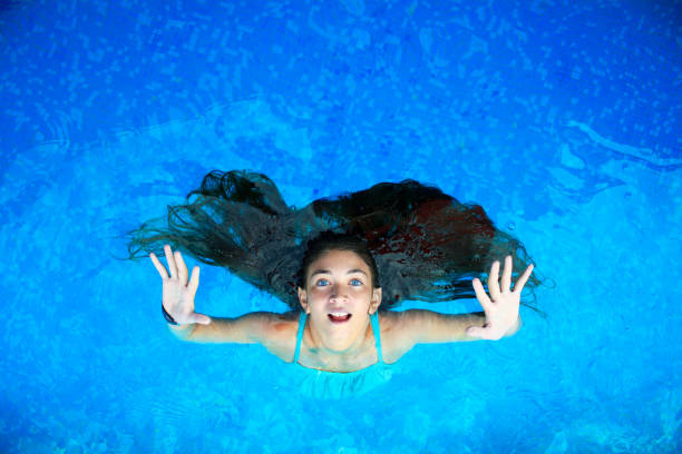 istock Young girl in a swimming pool 1143233162