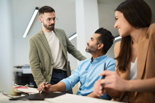 istock Standing business meeting in the office. 1143233410
