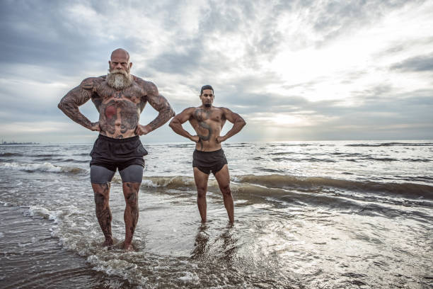 istock Tattooed Senior Man coaching young man During Workout 1143233500