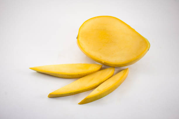 istock Yellow mango and mango slices isolated white background 1143234472