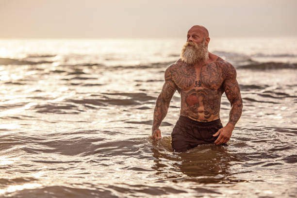 istock Tattooed Senior Man During Workout 1143234608