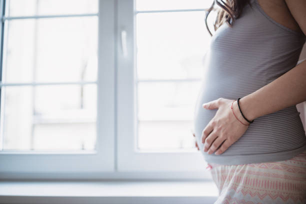istock Young future mother examines her belly 1143234964