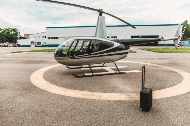 istock Black suitcase placed on the helicopter platform without people 1143235108