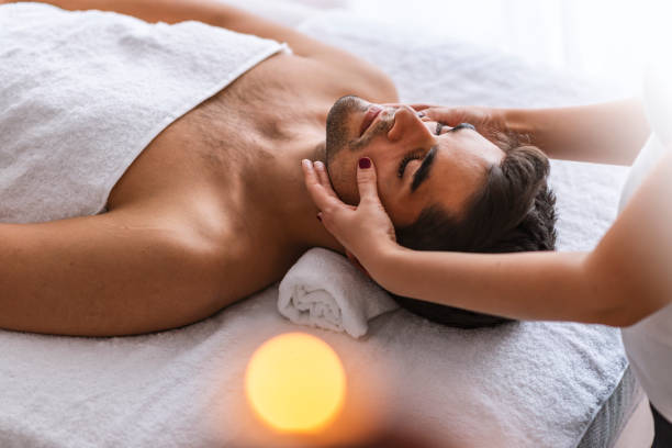 istock Man relaxing on massage table receiving massage. 1143236274