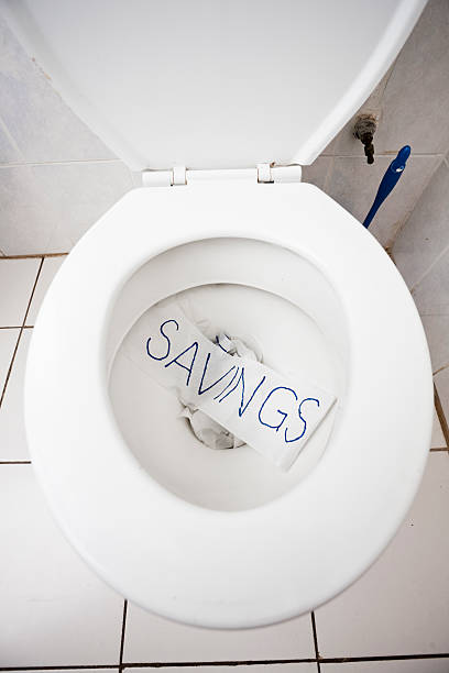 istock Savings go down the toilet 114323738