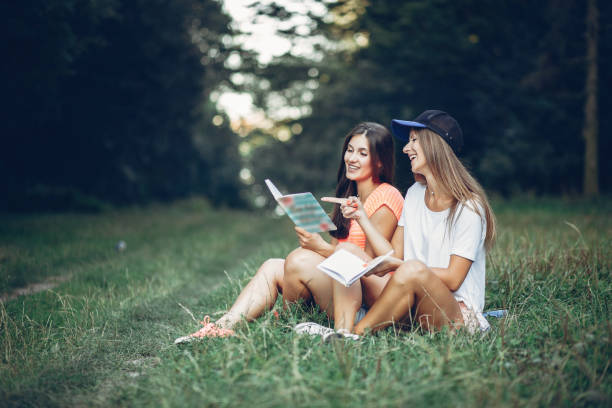 istock Two pretty girls in a summer park 1143238275