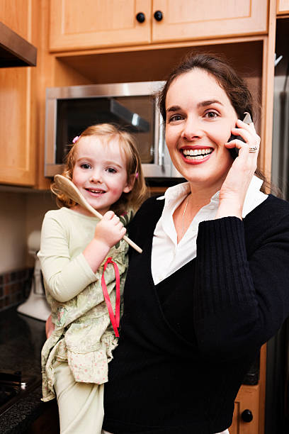 istock Busy mom with child and cell phone 114323863