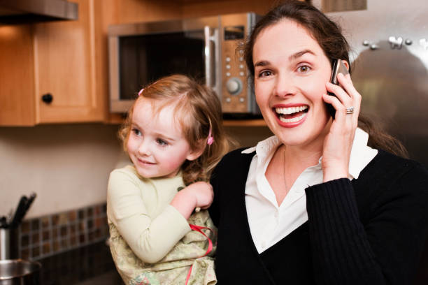 istock Busy mom with child and cell phone 114323897