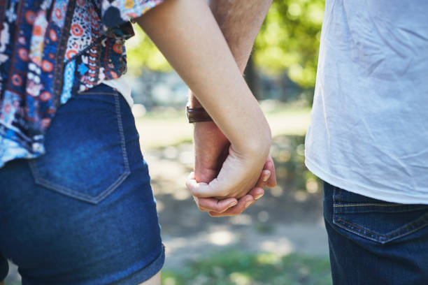 istock Clasped hands of a loving young couple 1143239815