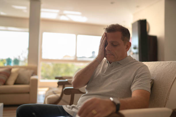 istock Worried and tired man doing home office 1143239909