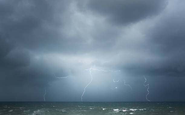 istock thunderstorm with lightning on the sea 1143240375