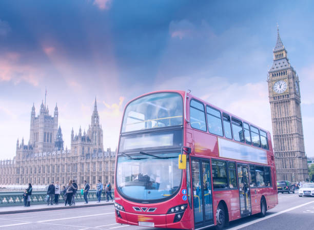 istock London. Classic red double decker bus crossing Westminster Bridge at sunset 1143240376