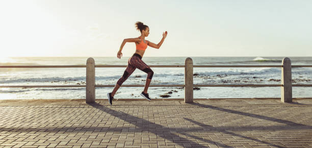 Woman sprinting on promenade