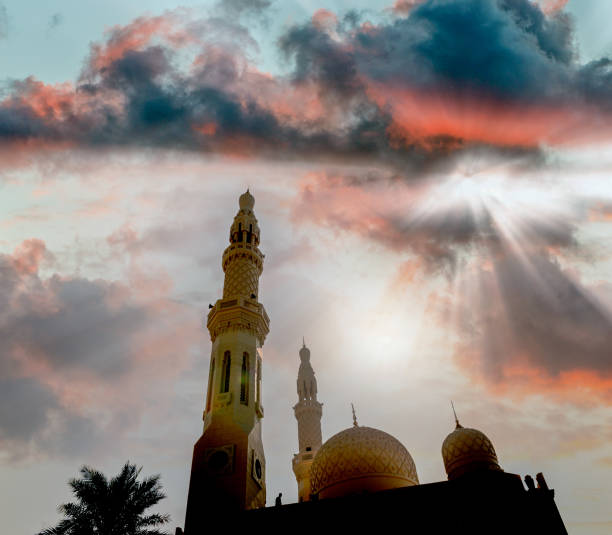 istock Mosque silhouette agains the shining sun 1143241406