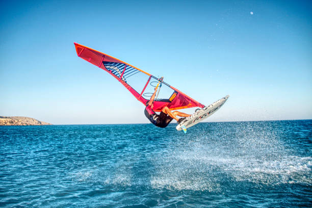Windsurfing Freestyle Prasonisi, Greece - august15, 2018 : Photo taken during the freestyle windsurfing training at Prasonisi in Greece. Freestyle is without doubt the most versatile of disciplines, providing action close to that of extreme wave performance, but in a wider variety of conditions. windsurfing stock pictures, royalty-free photos & images