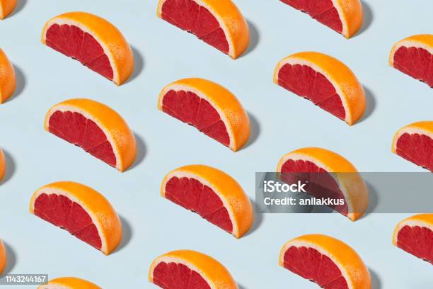Grapefruit Pattern On Soft Blue Background Stock Photo - Download Image Now - Fruit, Pattern, Food
