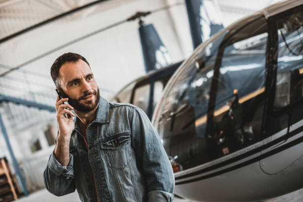 istock Satisfied bearded man telling on phone indoor 1143244529