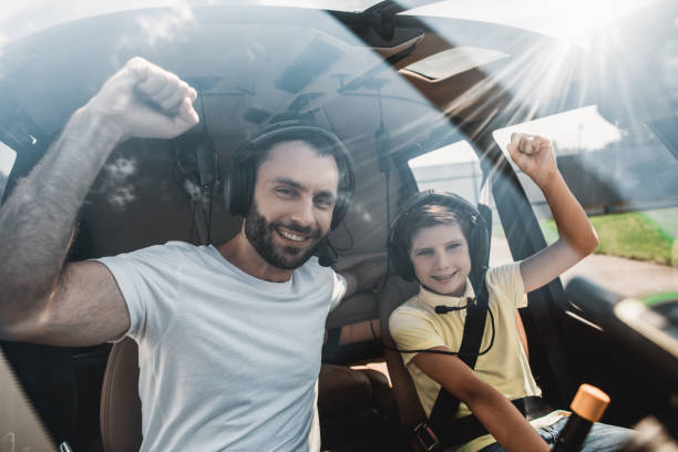 istock Happy kid and dad inside of rotorcraft 1143244683