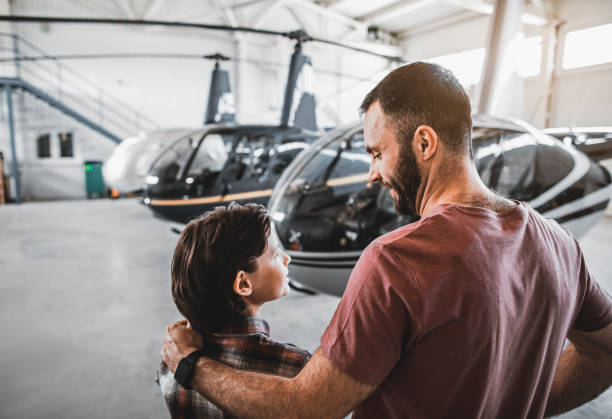 istock Positive child hugging smiling father opposite rotorcrafts 1143244691