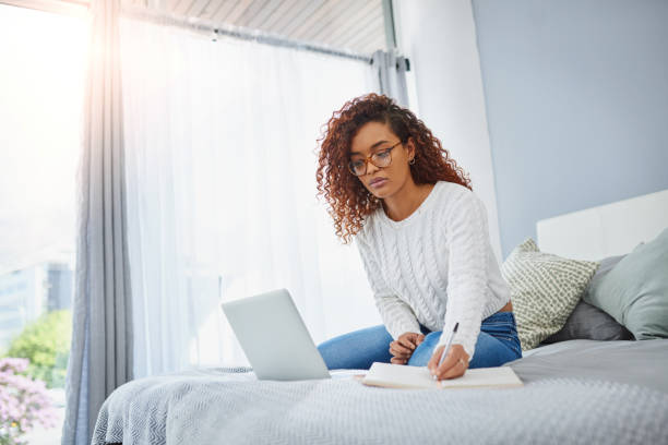 istock Jotting down new ideas for her blog 1143244852