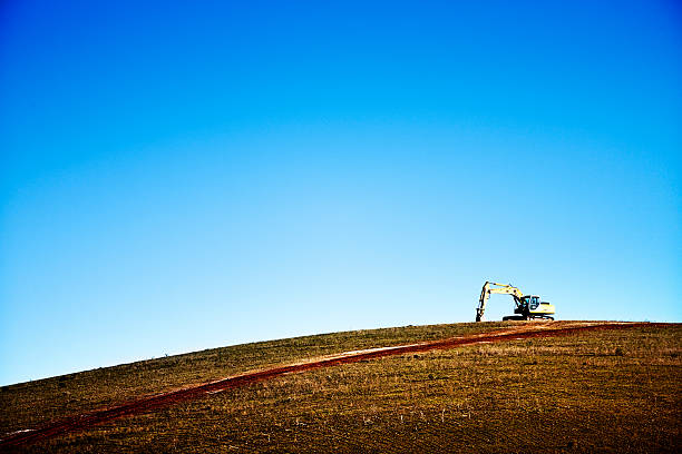 Excavator performing earthworks