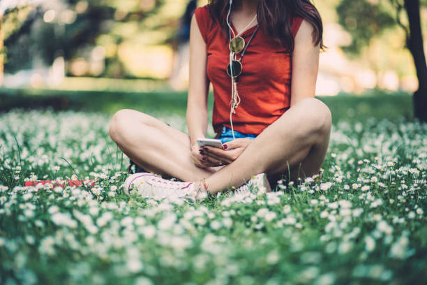 Girl in the park listening to music