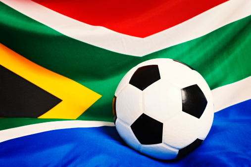Soccer player dribble a soccer ball with Ghana flag