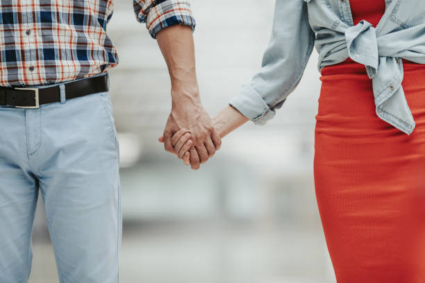 istock Female and man hands together 1143249839