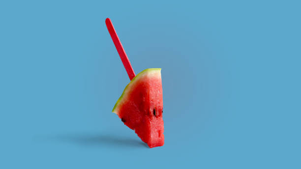 istock Watermelon popsicle yummy fresh summer fruit sweet dessert on blue background 1143251456