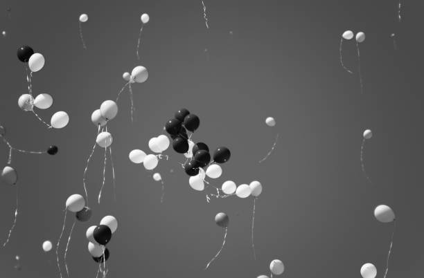 istock Multicolored balls, filled with helium, fly in the blue sky 1143252212