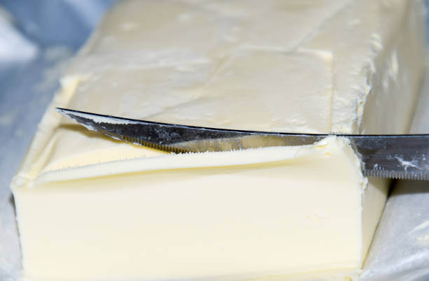 istock Cutting a butter knife. Butter and knife 1143252246