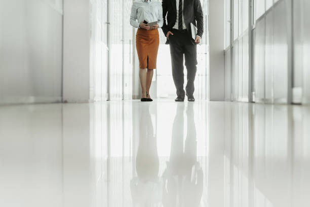 istock Woman moving with worker in corridor 1143253451