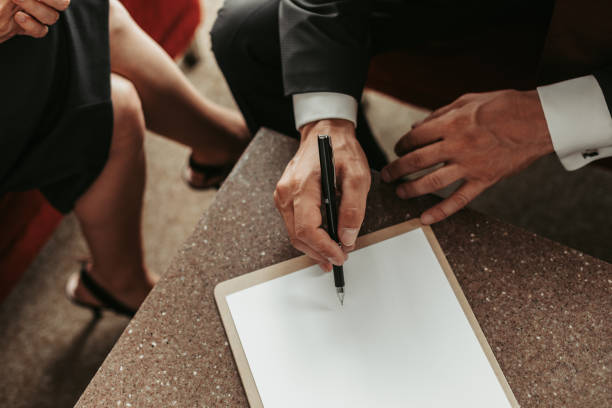 istock Employer signing contract with colleague 1143253461