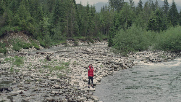 istock Man fishing in a mountain stream 1143254076