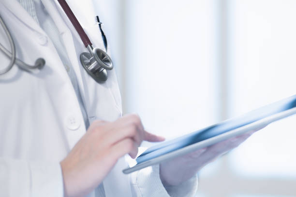 istock Medical doctor using smart tablet for work in hospital 1143255585