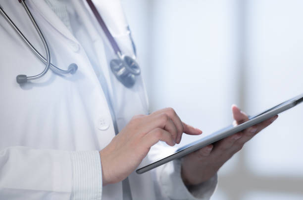 istock Medical doctor using smart tablet for work in hospital 1143255587